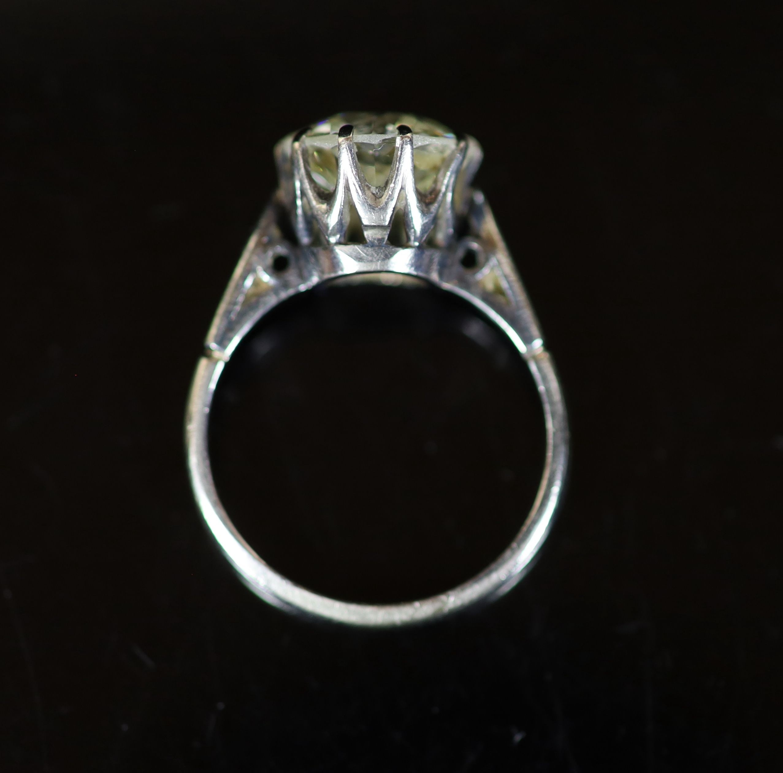 A platinum and solitaire diamond ring